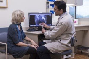 Ravi Bashyal talking to patient